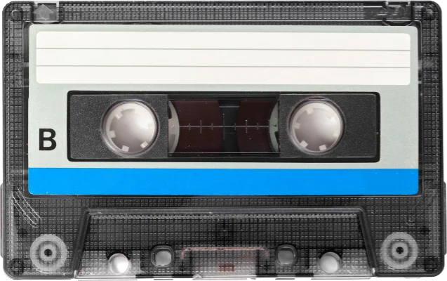Black audio cassette with a white label and blue stripe